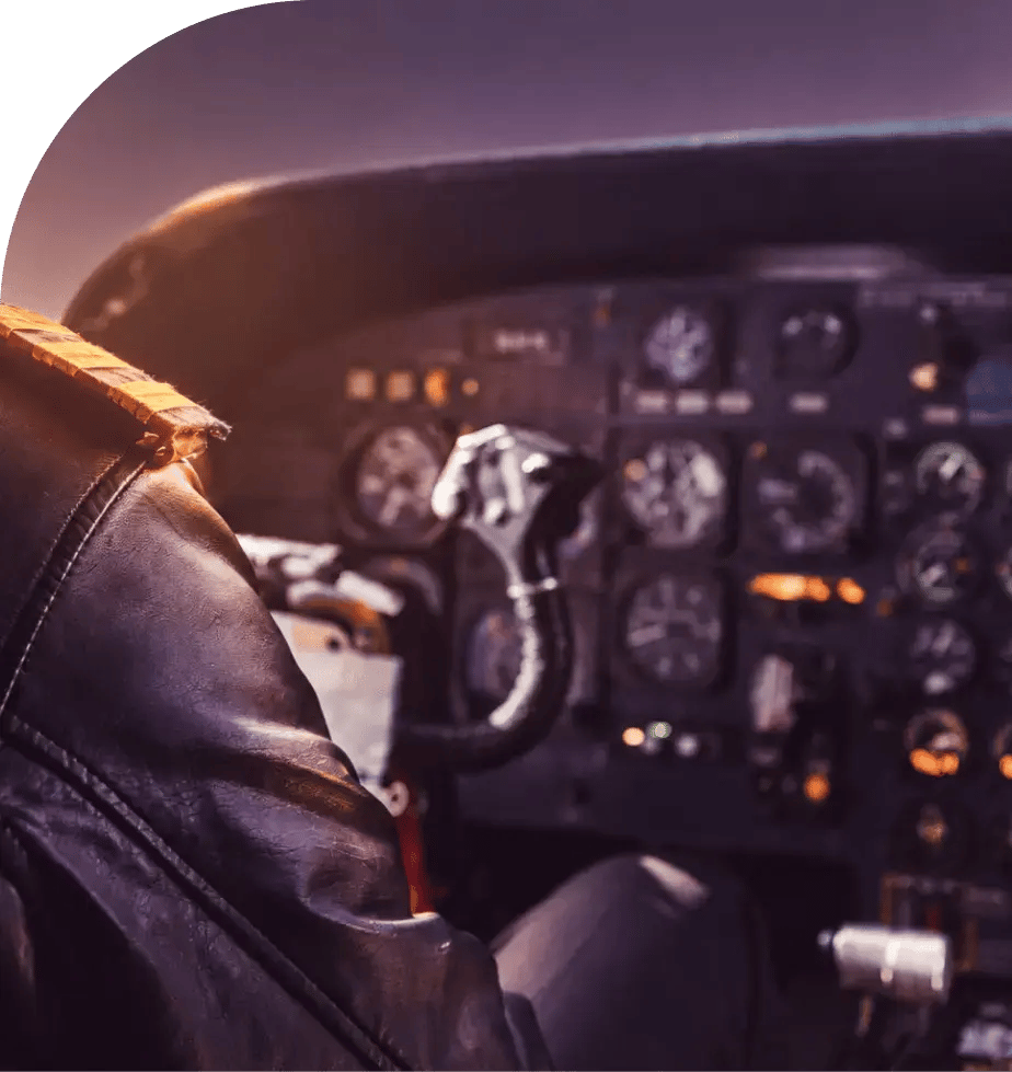 pilot in the cockpit at dusk