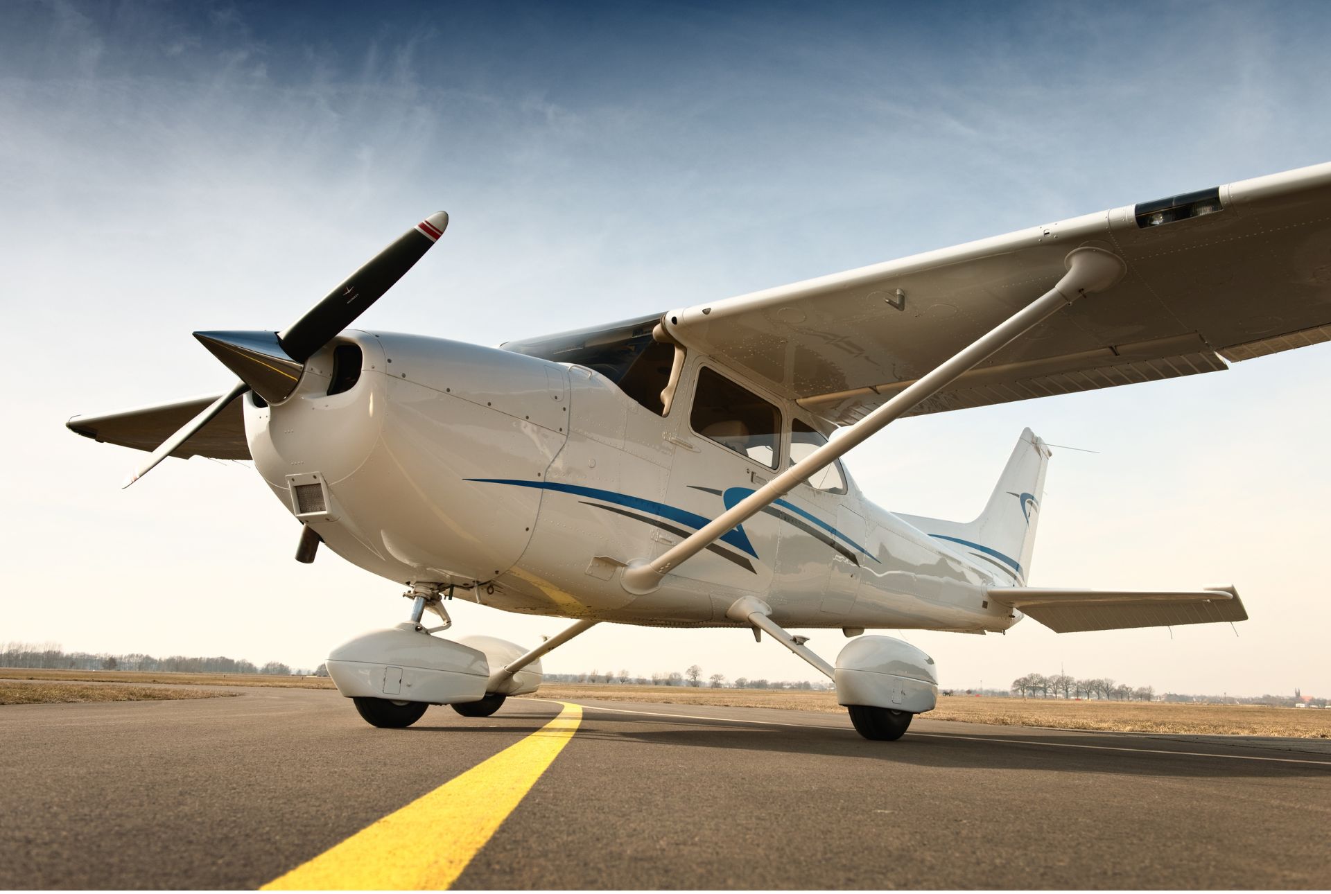Cessna 172 parked on tarmac runway