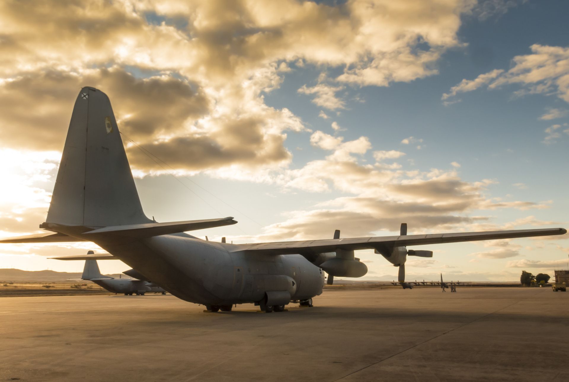 Lockheed Martin C-130 military aircraft parked on the tarmac
